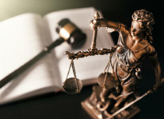 7 najbolj bizarnih zakonov Lady justice. Statue of Justice in library. Legal and law background concept