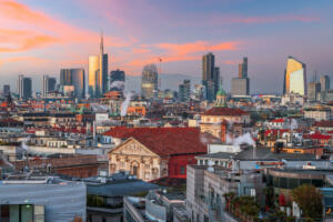 Milan, Italy city skyline with new and old architecture at dusk.