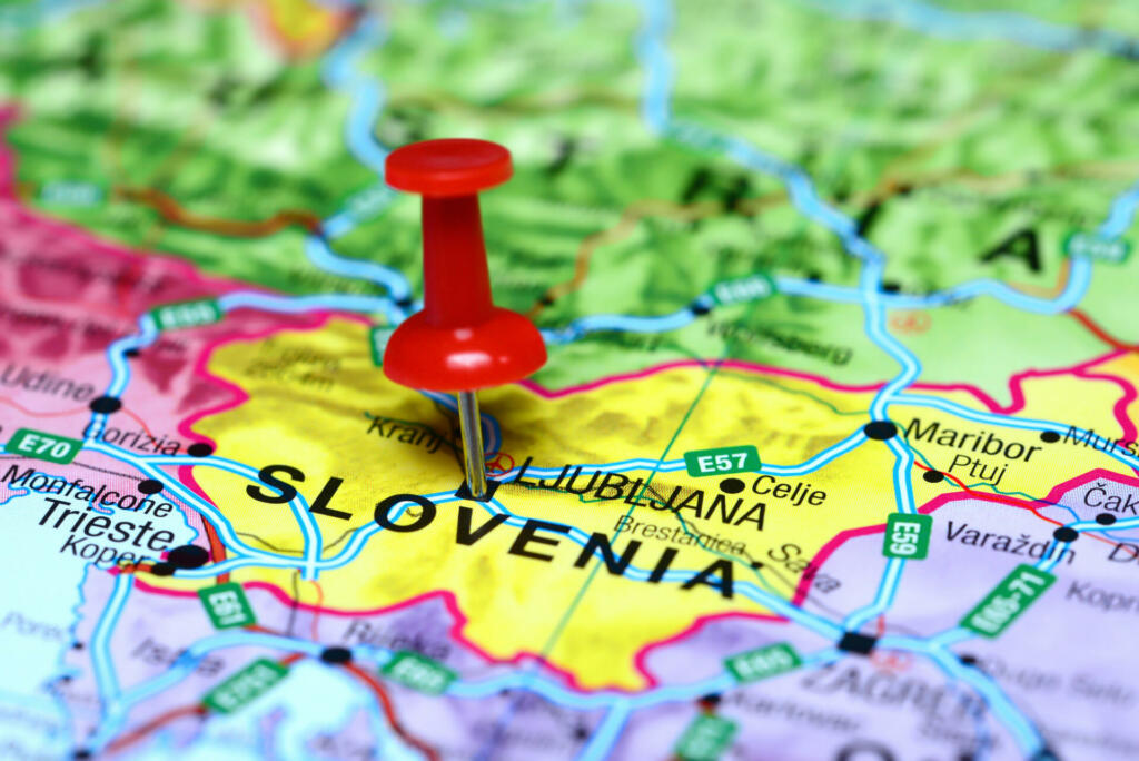 Photo of pinned Ljubljana on a map of europe. May be used as illustration for traveling theme.
