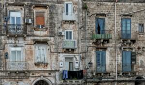 Taranto, Italy - 30 November, 2023: shabby chic derelict buildings with laundry hanging from the balconies in the Old Town of Taranto