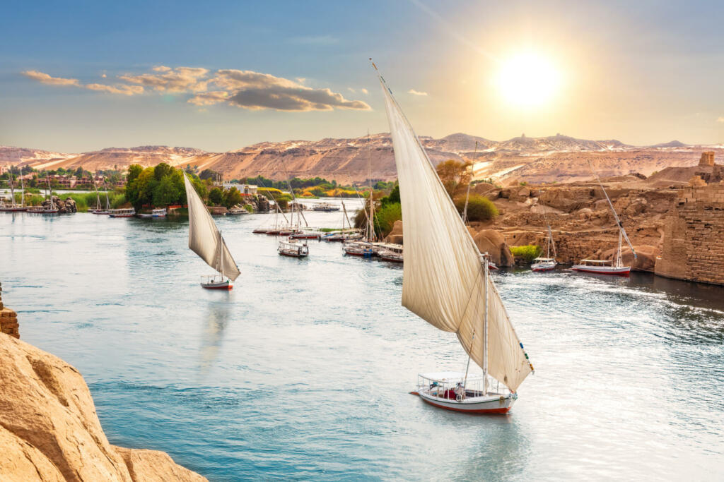 Traditional Nile sailboats near the banks of Aswan, Egypt.