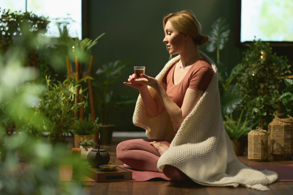 modern 30 years old woman with tea at modern green home.