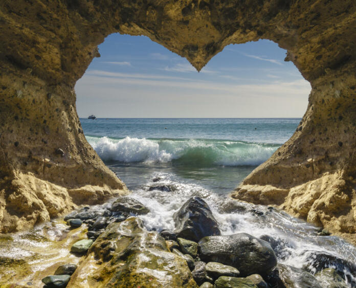 view of the ocean from a heart-shaped cave