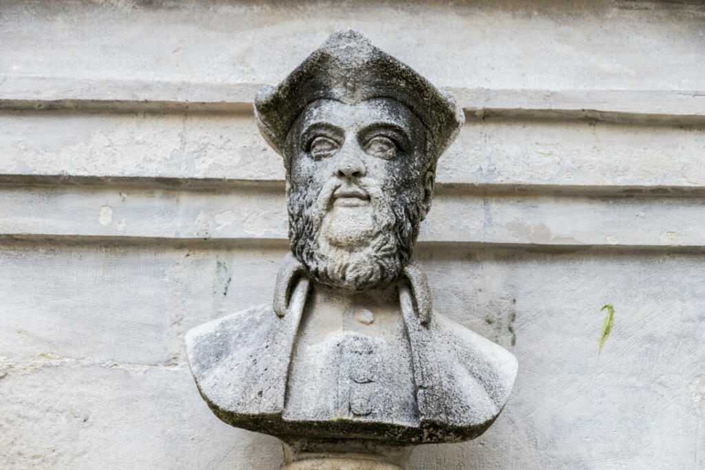 Water fountain with a bust of Michel de Nostradame or Nostradamus in the Old Town of his hometown and birthplace of Saint-Remy-de-Provence, France