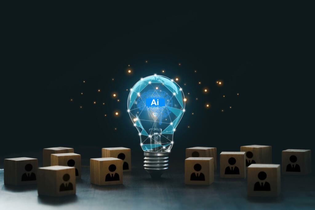 Artificial intelligence innovation. AI adoption and working. AI with a digital brain in a lightbulb with human icons in wooden blocks for AI vs human competition. manage personnel in the organization