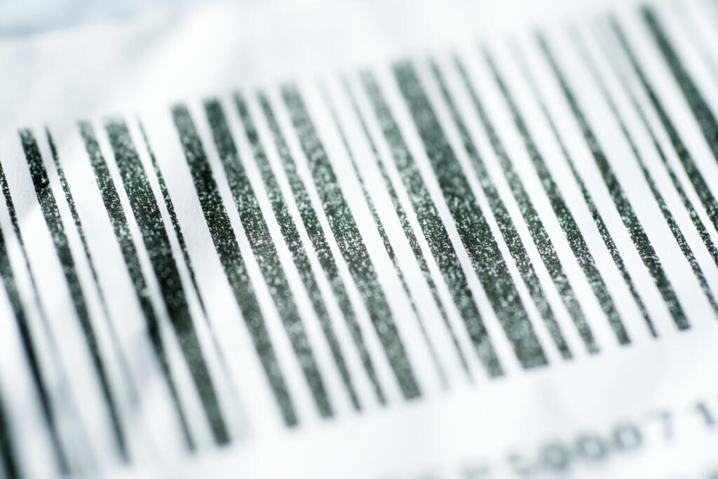Close up of a barcode printed on brown cardboard