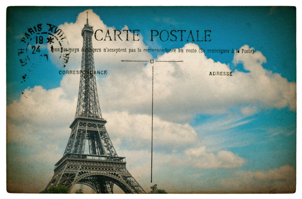 empty antique french postcard from paris with eiffel tower and blue sky. vintage sentimental retro style paper background