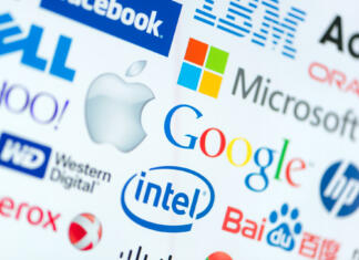 5 tehnoloških obletnic v letu 2024 Kiev, Ukraine - June 12, 2014: A logotype collection of well-known world top companies of computer technologies on a monitor screen. Include Google, Apple, Microsoft, Intel and other logos.