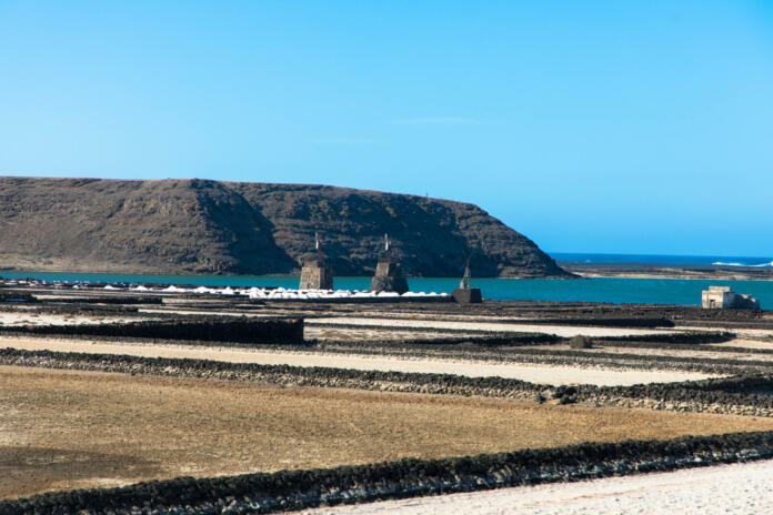 On the south coast of Lanzarote, near the fishing village of El Golfo, is the salt mining plant Salinas de Janubio, which is separated from the open sea by a headland. Aerial view. Canary Islands, Spain, Europe