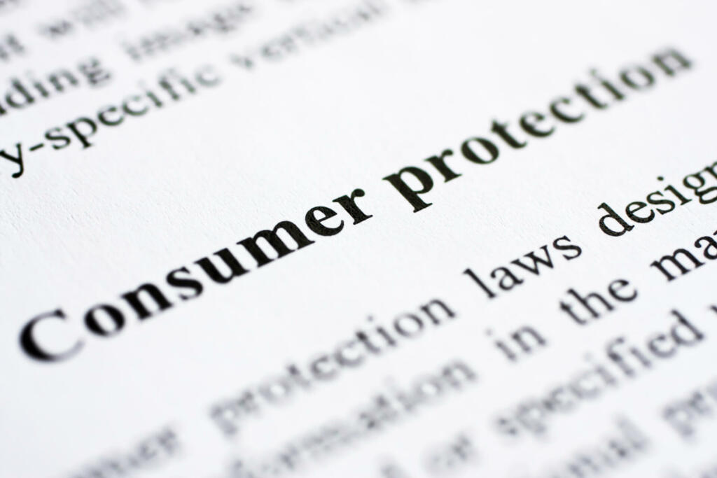 The words Consumer protection shot with artistic selective focus.