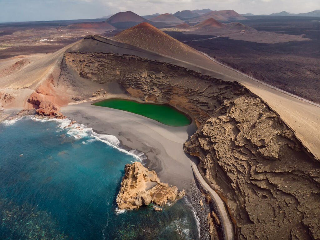 Volcanic crater with a crater lake near El Golfo, Lanzarote island. Aerial view