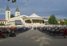 Komentar: kaj nas je naučilo Medžugorje? Medugorje, Bosnia and Herzegovina - Sep 20, 2023: Site of Catholic pilgrimage due to Our Lady of Medjugorje. Apparitions of the Virgin Mary mother of Jesus. Sunny summer day. Selective focus