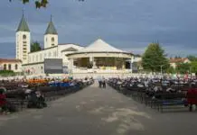 Komentar: kaj nas je naučilo Medžugorje? Medugorje, Bosnia and Herzegovina - Sep 20, 2023: Site of Catholic pilgrimage due to Our Lady of Medjugorje. Apparitions of the Virgin Mary mother of Jesus. Sunny summer day. Selective focus