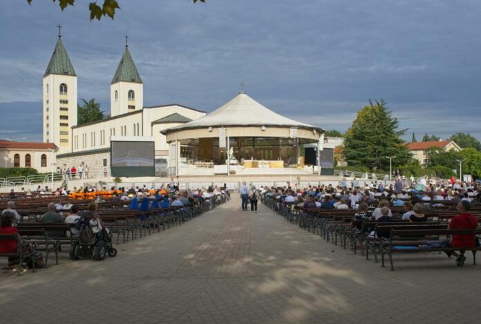 Medugorje, Bosnia and Herzegovina - Sep 20, 2023: Site of Catholic pilgrimage due to Our Lady of Medjugorje. Apparitions of the Virgin Mary mother of Jesus. Sunny summer day. Selective focus