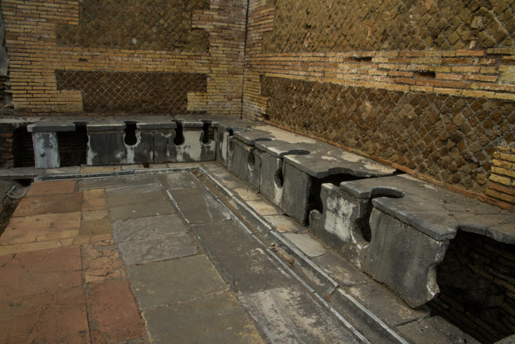 Roman public lavatories, at Ostia Antica, roman city. Rome in Italy.