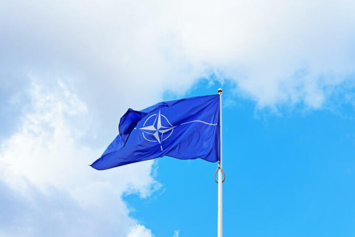 Vilnius, Lithuania - September 3, 2015: NATO flag waving by the wind