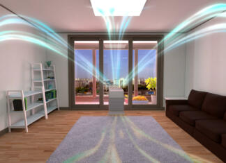 Kako premagati čas alergij? Odgovor je jasen 3D rendering of a white air cleaner making indoor air fresh all day in a closed room with a wood floor, a gray mat, a sofa, and bookshelves in a neat house with nice view of balcony.