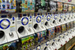 Kyoto, Japan, August 16, 2019 – Row of gashapon vending machines selling capsule toys related to cartoons and manga characters