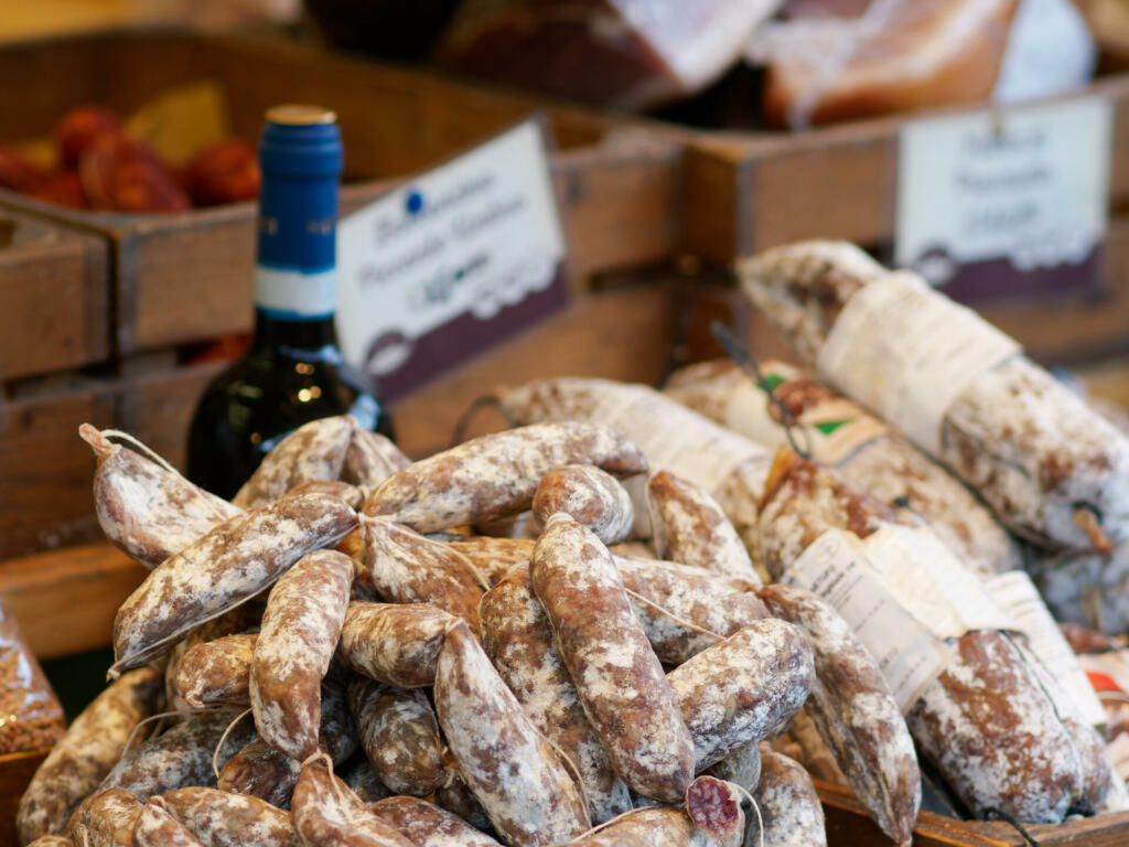 Sausages and salami, typical products on display outside a shop in Norcia, Italy