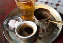 Kako deluje kofein? Traditional Bosnian Coffee served from a copper pot with local sweets. Sarajevo, Bosnia and Herzegovina