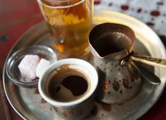 Kako deluje kofein? Traditional Bosnian Coffee served from a copper pot with local sweets. Sarajevo, Bosnia and Herzegovina