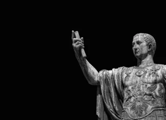 Najbolj odmevni atentati v zgodovini Caesar Augustus Nerva Emperor of Ancient Rome bronze statue along Imperial Fora road in Rome