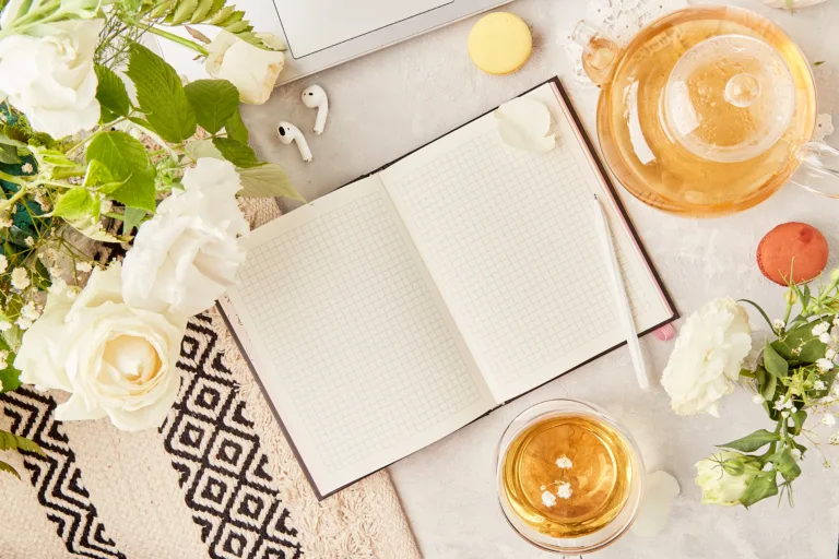 Open notebook mock up, herbal tea. Aesthetic tea time, feminine meditative lifestyle in biophilic interior, cozy home. Copy space.