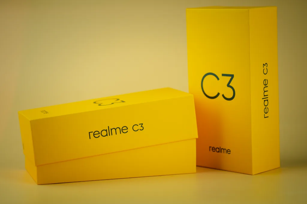 Samut Prakan, Thailand - June 29, 2020 : Yellow box of Realme C3 entry-level Android smartphone on yellow background