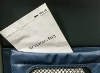Top 5 nenavadnih hobijev, ki jih ljudje prakticirajo Air sickness bag tucked behind airplane seat pocket for nauseous passenger