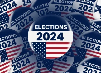 Harris ali Trump: Komu kaže bolje? American presidential elections banner. Realistic circle Vote sticker or badge with us american flag. US, USA, american election, voting sign. 2024 presidential elections. Responsible voting badge or pin.