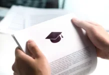 Objavljen nagradni natečaj za ‘študentske’ naloge o Slovencih v zamejstvu in po svetu College or university application or letter from school. Student or teacher reading education document. Young man holding grant, graduation, study loan or scholarship paper.