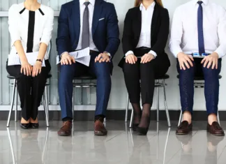 Kako izgleda popoln outfit za službeni intervju? Business people waiting for job interview. Four candidates competing for one position