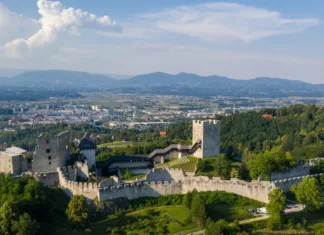 Kam na Teden restavracij na Štajerskem? Celje, Slovenia - June 27, 2020: Celje Castle is a castle ruin in Celje, Slovenia, formerly the seat of the Counts of Celje. It stands on three hills to the southeast of Celje, where the river Savinja meanders into the Lasko valley