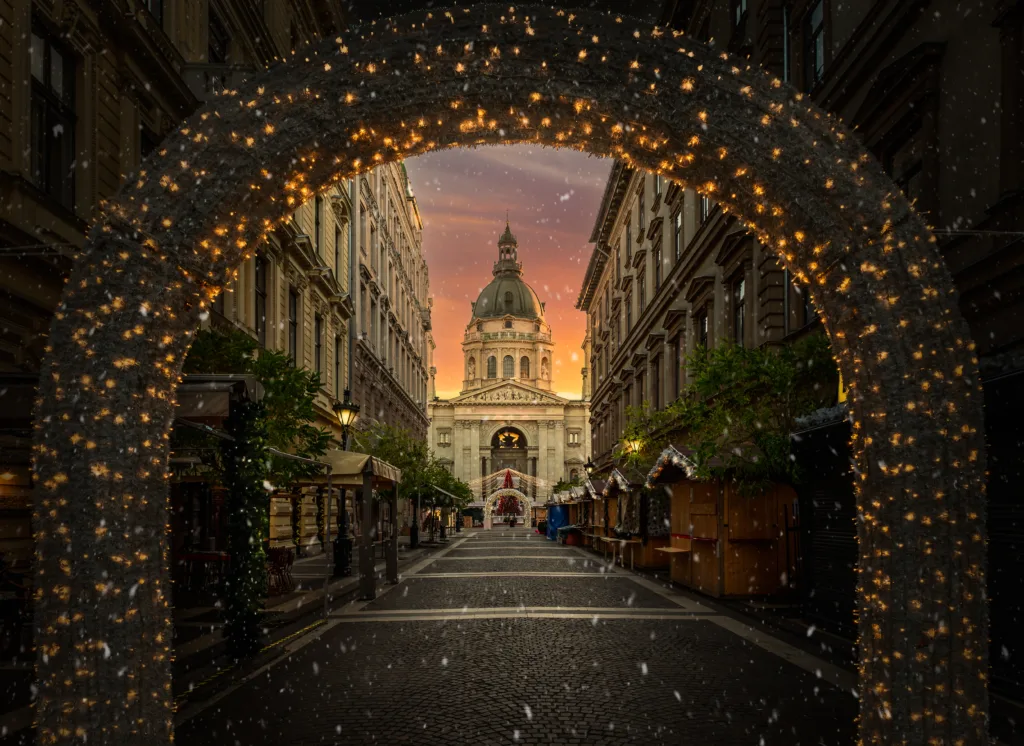 Christmas market at Saint Stephen Basilica in Budapest, with festive lights and holiday charm, Hungary
