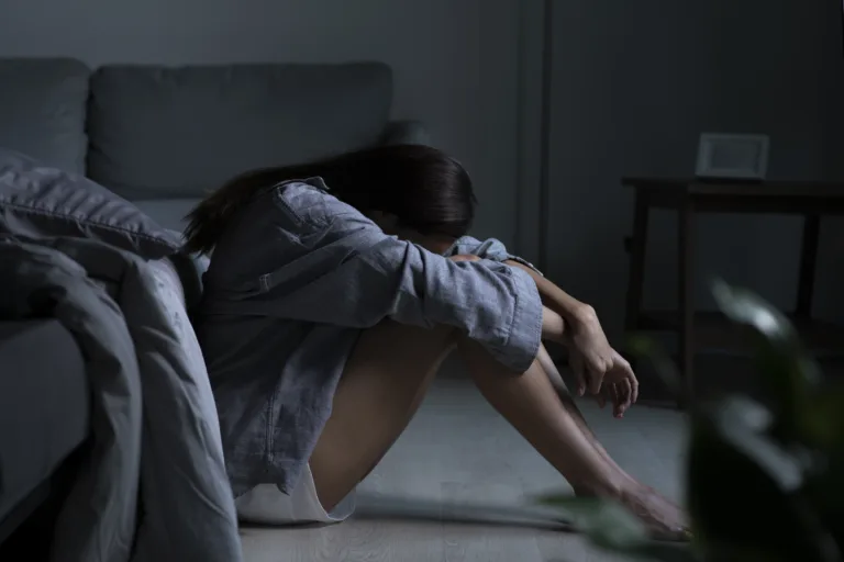 Young Asian woman in bedroom feeling sad tired and worried suffering depression in mental health