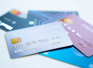 Kaj je SWIFT koda in kako jo najti? Credit cards stacked on white background