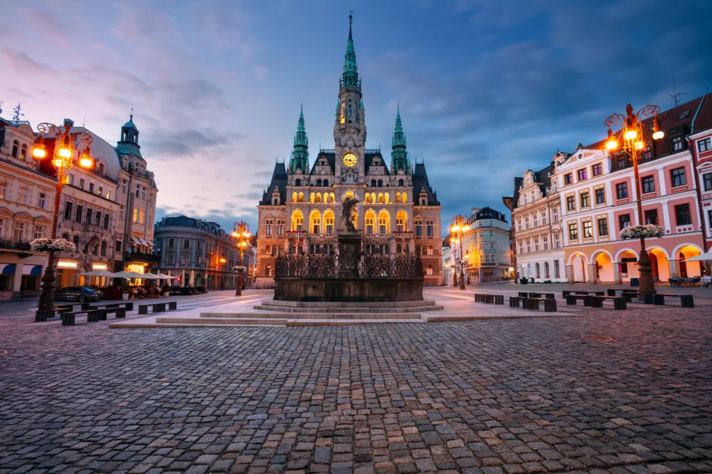 Cityscape image of downtown Liberec, Czech Republic with Liberec Town Hall and Fountain of Neptun at summer sunset.