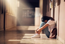 Bi lahko antidepresive predpisali z DNA testom? Stress, anxiety and depression of university girl with mental breakdown on campus floor. Frustrated, thinking and depressed indian woman suffering and overwhelmed with burnout at college.