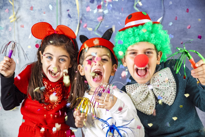 Three kids celebrating Carnival together at home