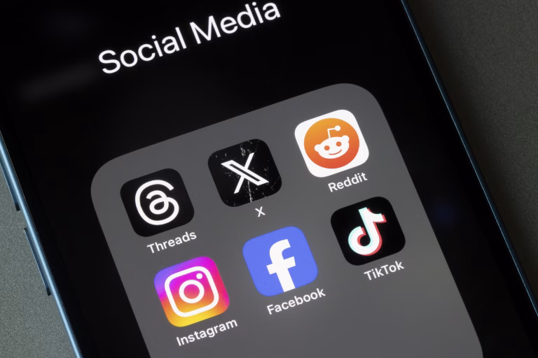 Portland, OR, USA - Oct 26, 2023: Assorted social media apps, including Threads, X, Reddit, Instagram, Facebook, and TikTok, are seen on an iPhone.