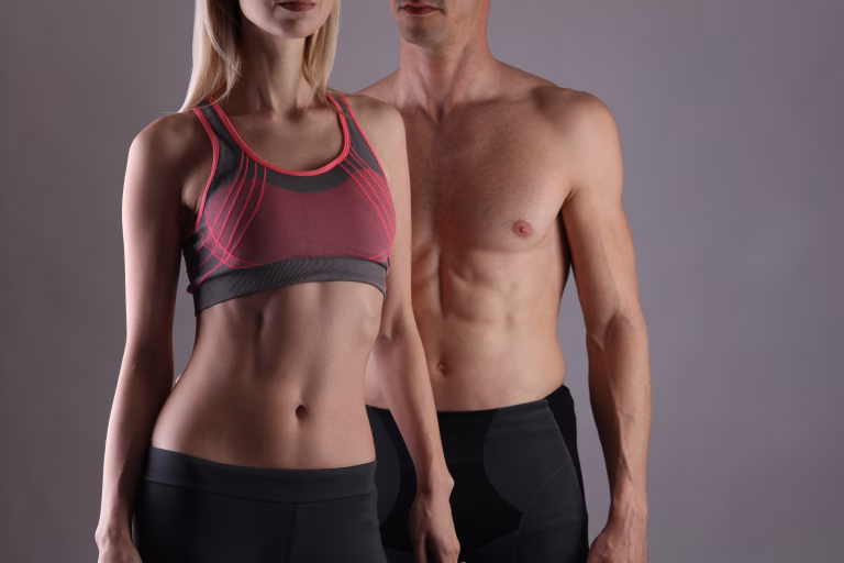 Fit couple, strong muscular man and slim woman . Sport, fitness ,workout concept. Copy space