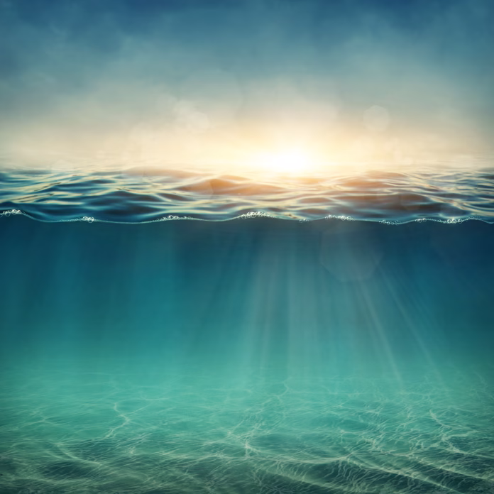 Abstract underwater background with sunbeams