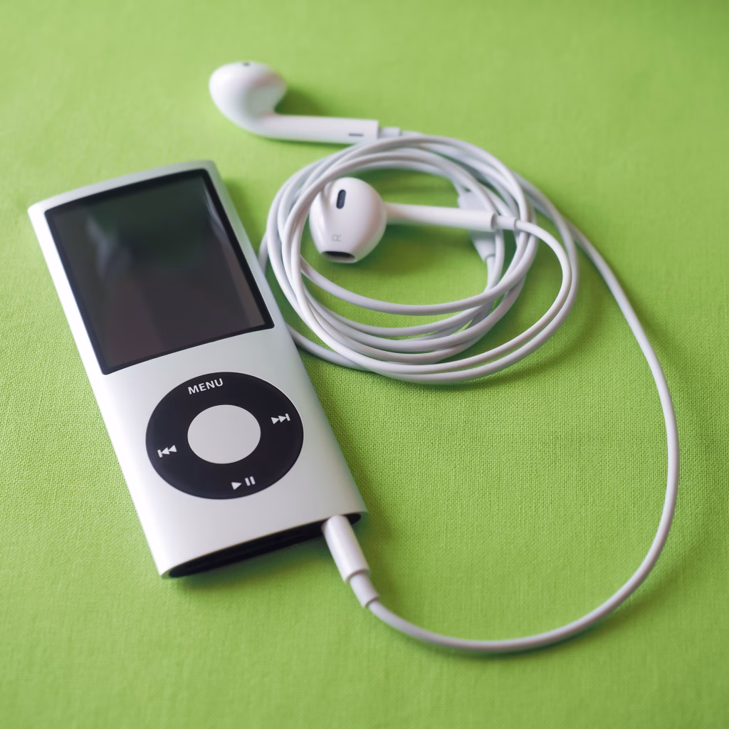 Berry, Australia - June 23, 2016: An Apple iPod Nano 4th generation, in silver, with Apple Earpods attached.