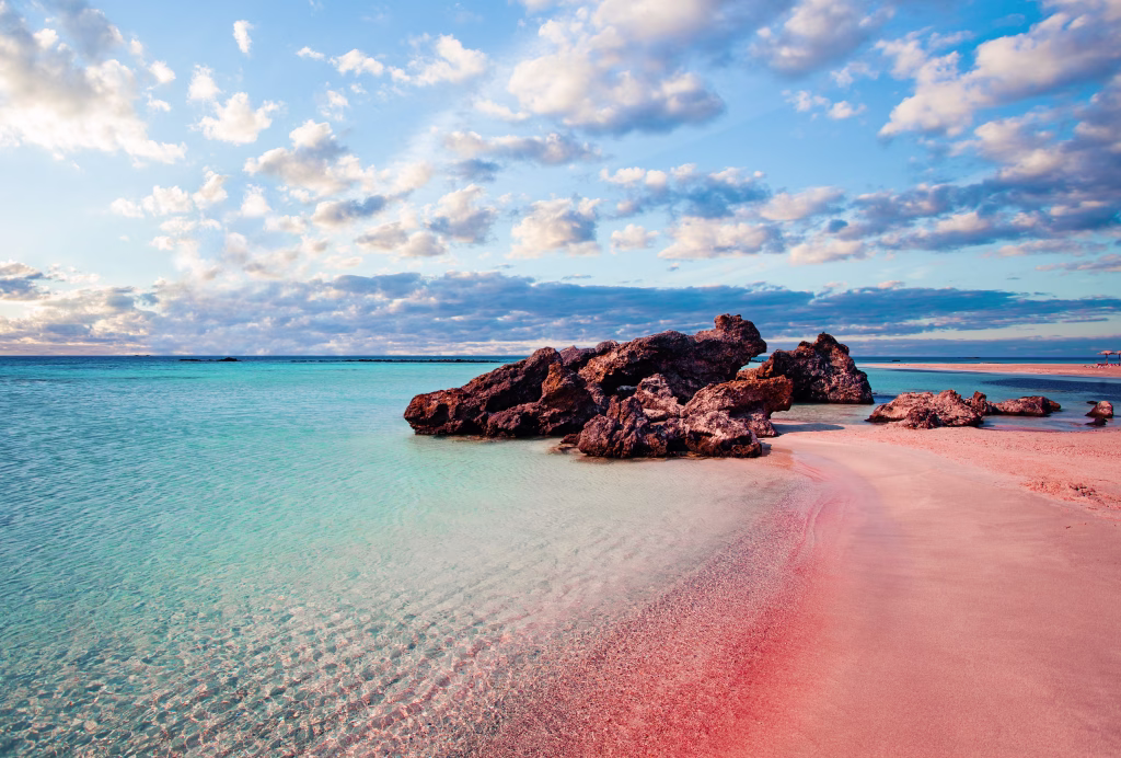 Crete skyline. Elafonissi beach with pink sand against blue sky with clouds on Crete, Greece