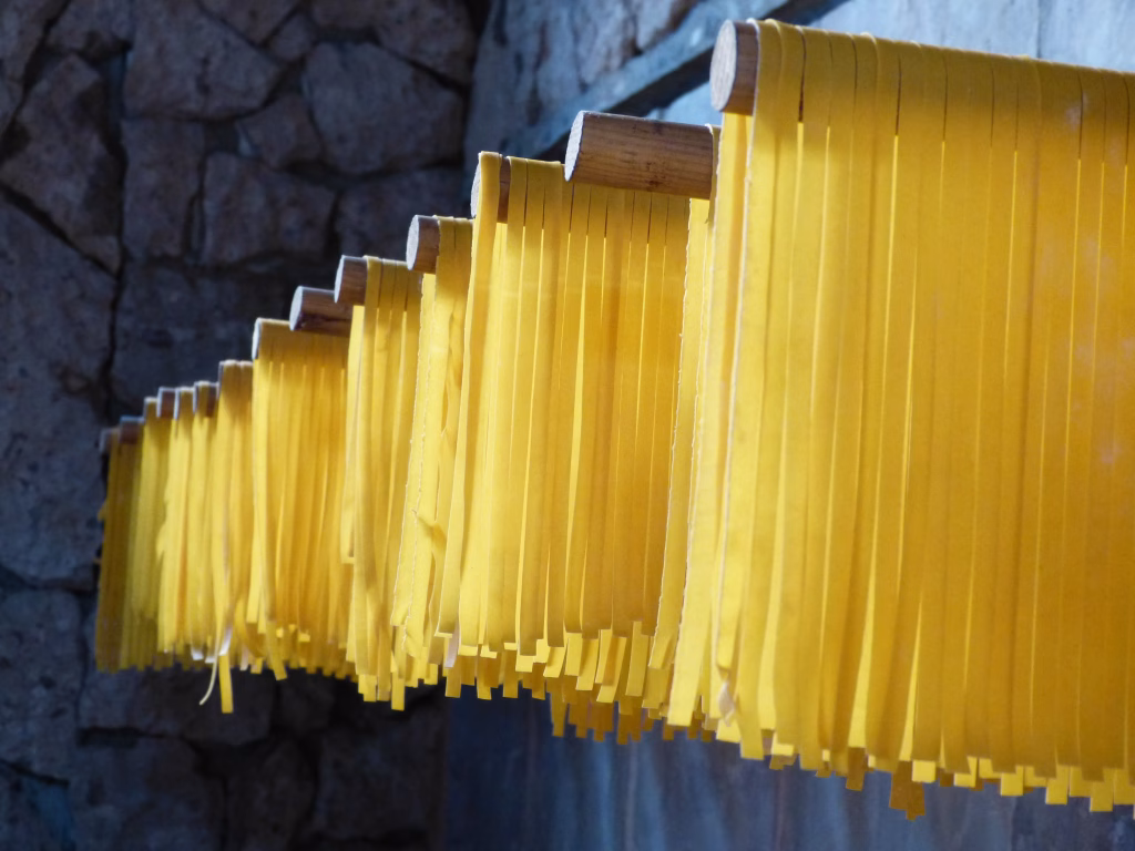 Pasta hung to dry on rods. Italian restaurant in La Cruz, Mexico