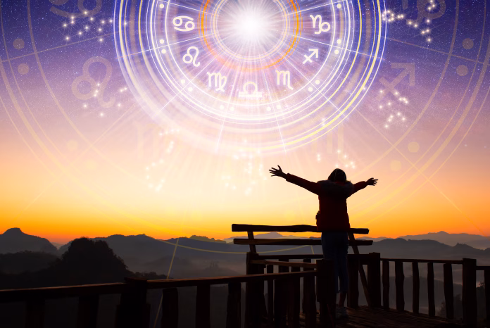 woman-raising-hands-looking-at-the-sky-astrological-wheel-projection-choose-a-zodiac-sign-trust-horoscope-future-predictions-consulting-stars-power-of-universe-astrology-esoteric-concept-stockpack-istock Woman raising hands looking at the sky. Astrological wheel projection, choose a zodiac sign. Trust horoscope future predictions, consulting stars. Power of universe, astrology esoteric concept.