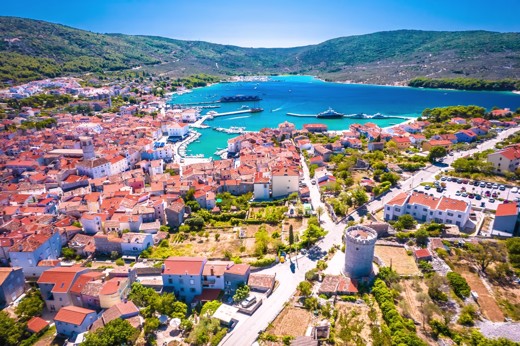 Adriatic town of Cres tower and bay aerial view, Kvarner archipelago of Croatia