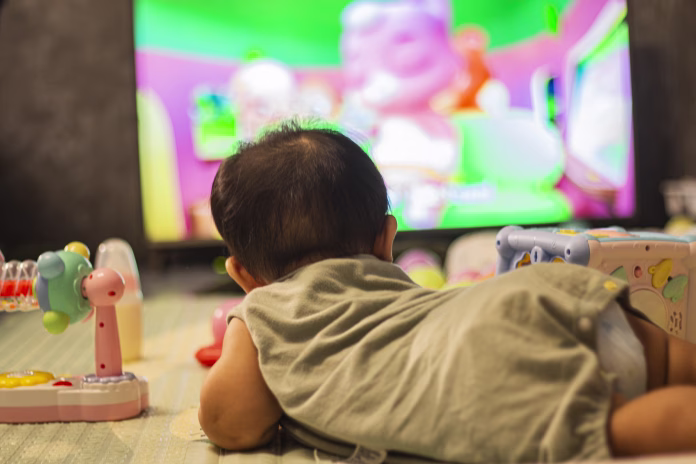 Baby Looking Television In Bedroom, background for advertisement and wallpaper in relaxation corner and home scene. Actual images in decorating ideas