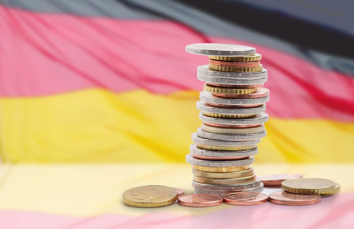 coins-stacked-on-each-other-in-different-positions-with-germany-flag-stockpack-istock Coins stacked on each other in different positions with Germany flag