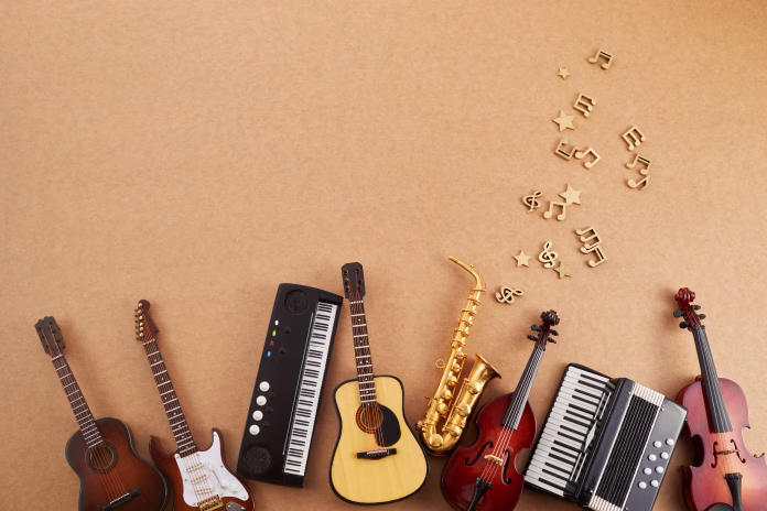Happy world music day. Musical instruments on brown background
